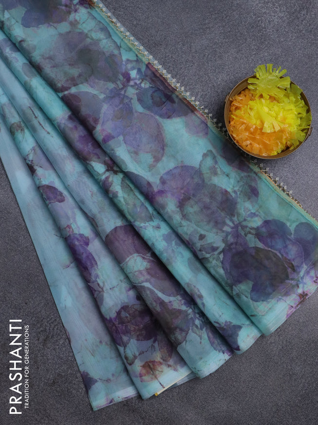 Semi organza saree light blue with allover floral prints in borderless style