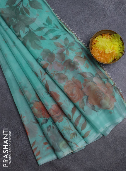 Semi organza saree teal green shade with allover floral prints in borderless style