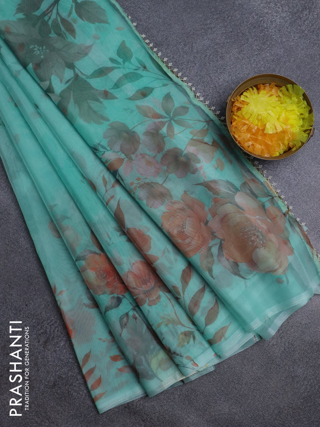 Semi organza saree teal green shade with allover floral prints in borderless style