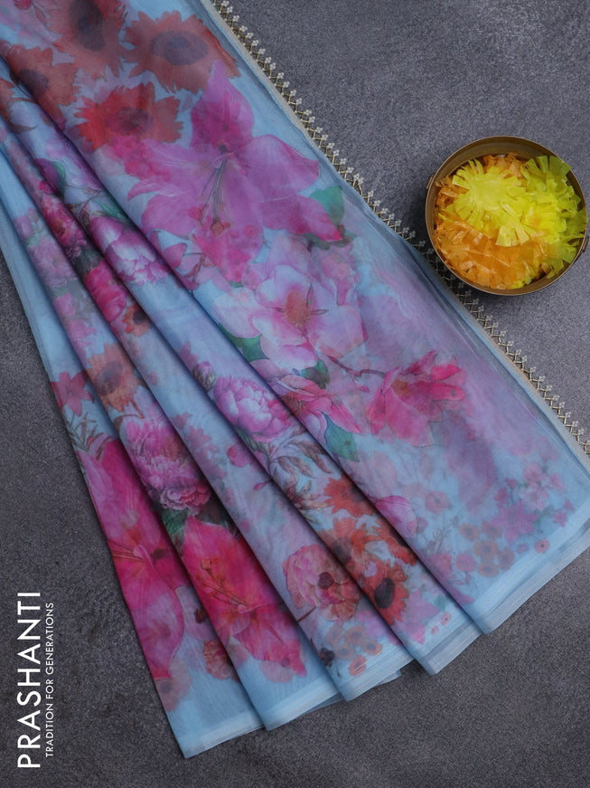 Semi organza saree pastel blue with floral butta prints in borderless style