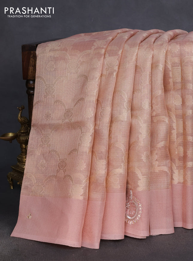 Kota tissue saree pastel peach with floral prints & pita work and zardosi work butta border