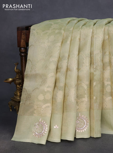 Kota tissue saree pista green with floral prints & pita work and zardosi work butta border
