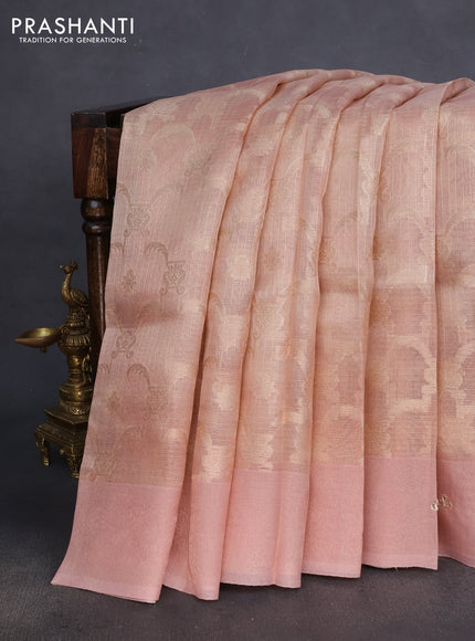 Kota tissue saree pastel peach with floral prints & pita work and zardosi work butta border