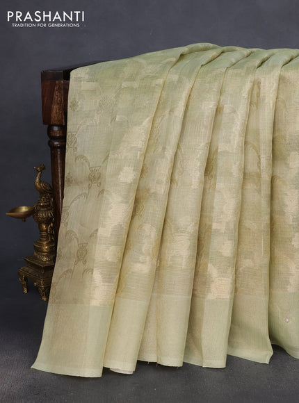 Kota tissue saree pista green with floral prints & pita work and zardosi work butta border