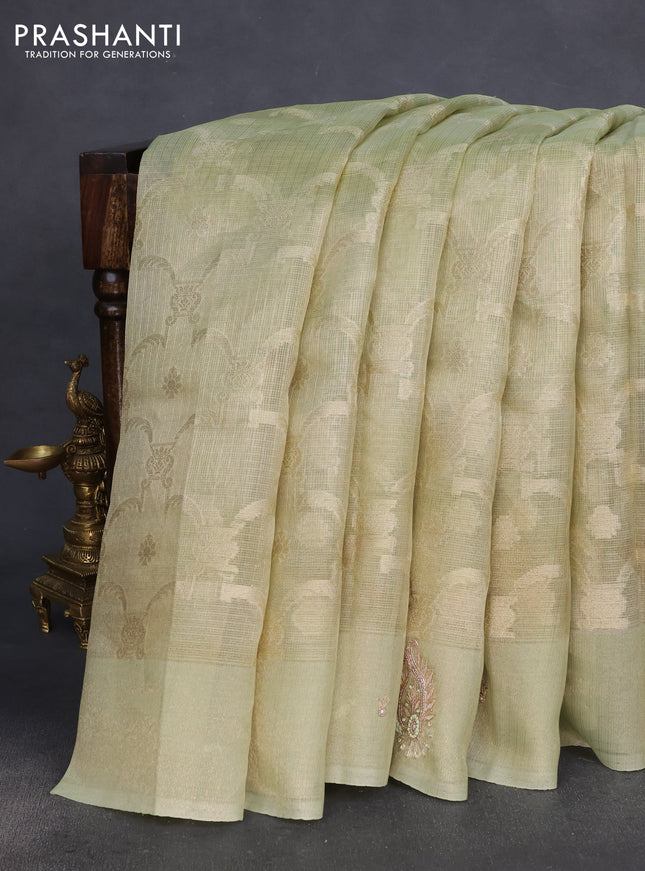 Kota tissue saree pista green with floral prints & pita work and zardosi work butta border