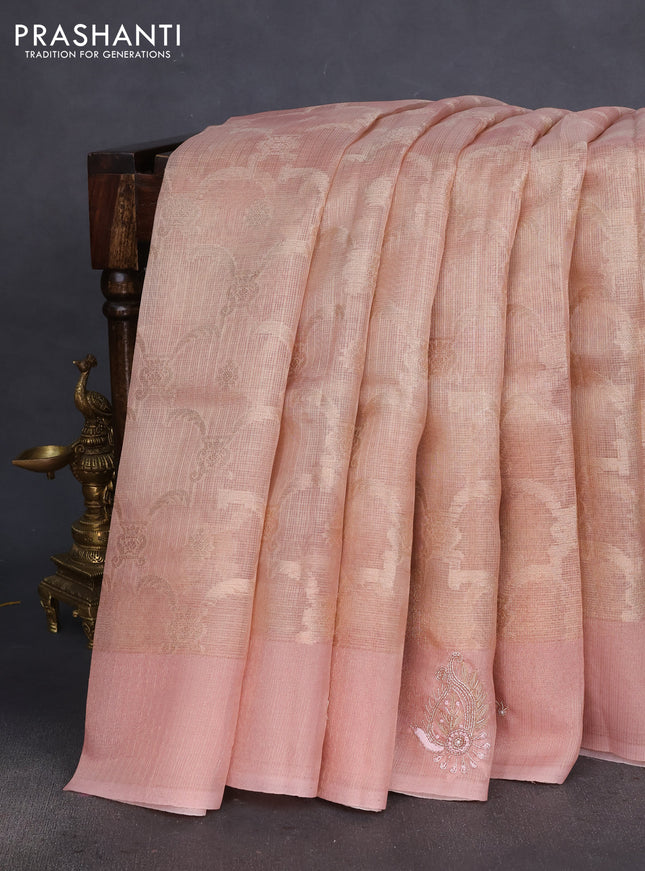 Kota tissue saree pastel peach with floral prints & pita work and zardosi work butta border