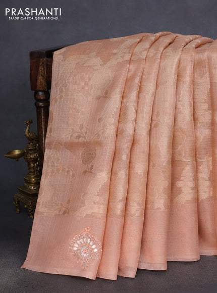 Kota tissue saree pastel peach with floral prints & pita work and zardosi work butta border