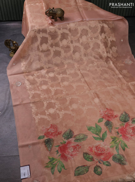 Kota tissue saree pastel peach with floral prints & pita work and zardosi work butta border