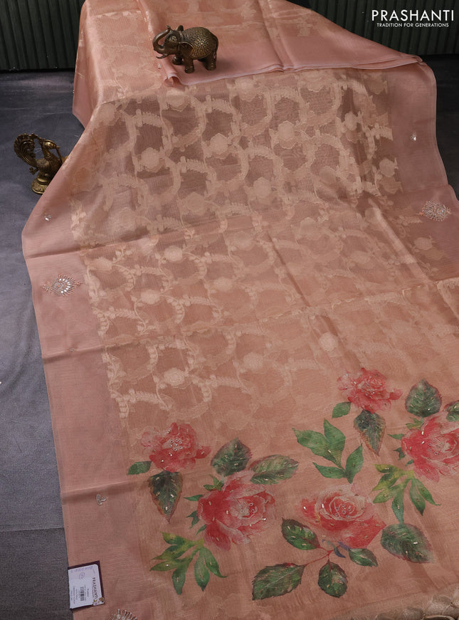 Kota tissue saree pastel peach with floral prints & pita work and zardosi work butta border