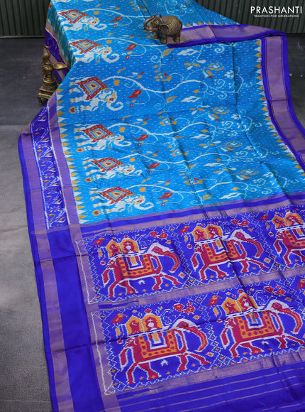 Pochampally silk saree dual shade of cs blue and royal blue with allover ikat weaves and temple design ikat woven border