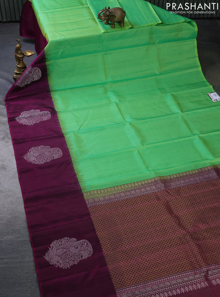 Pure soft silk saree dual shade of green and purple with allover small zari checked pattern and long silver zari woven butta border