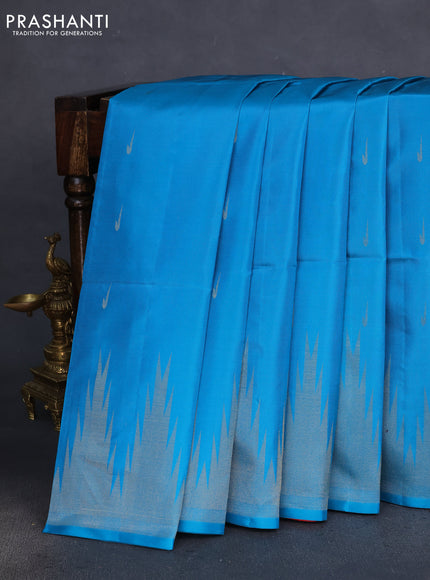 Pure soft silk saree cs blue and dual shade of pinkish orange with zari woven muniya buttas and temple design zari woven border