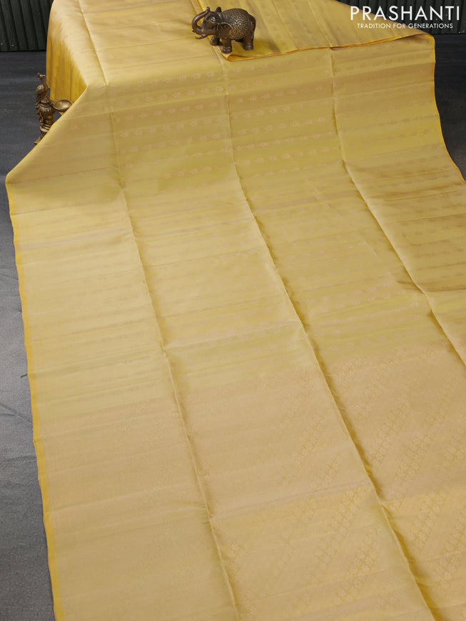 Pure soft silk saree yellow with allover floral zari woven buttas in borderless style