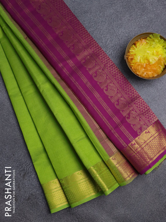Silk cotton saree light green and purple with plain body and zari woven border