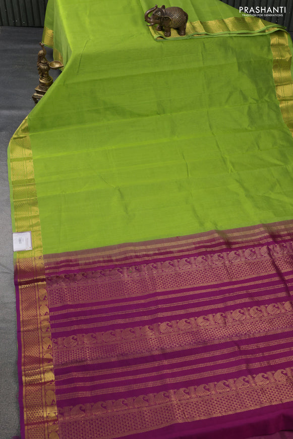 Silk cotton saree light green and purple with plain body and zari woven border
