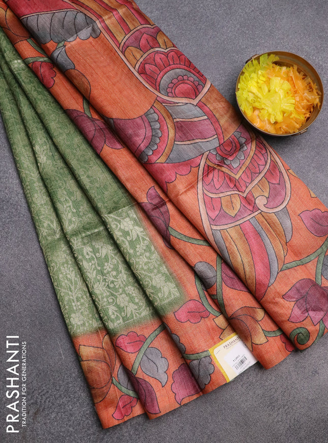 Semi jute silk saree green and orange with allover zari woven brocade weaves and kalamkari printed pallu