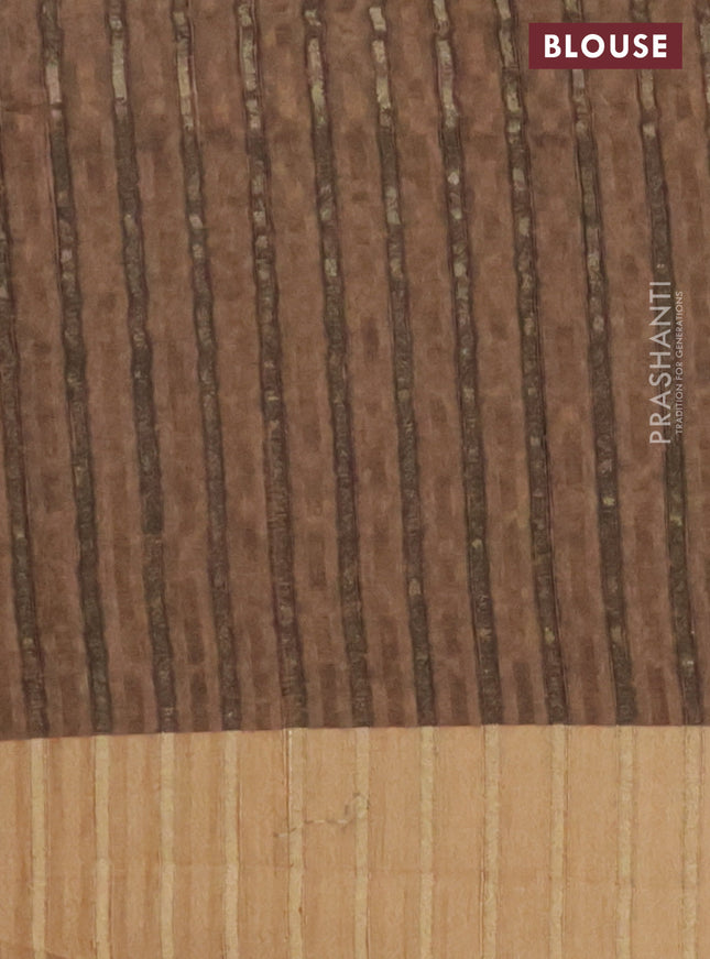 Semi matka saree brown shade and yellow with allover ikat prints and zari woven border