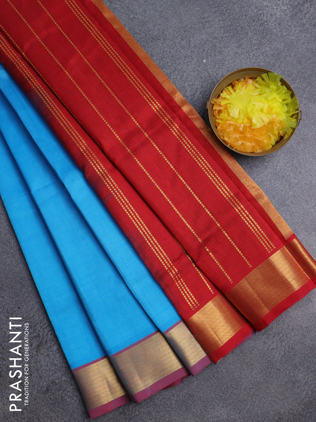 Silk cotton saree light blue and red with plain body and zari woven border