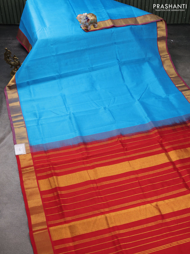 Silk cotton saree light blue and red with plain body and zari woven border