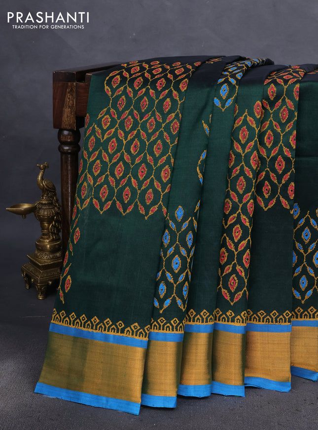 Silk cotton block printed saree bottle green and cs blue with butta prints and zari woven border