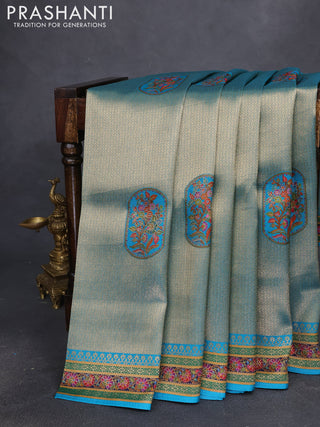 Banarasi silk saree teal blue shade with position prints and printed border