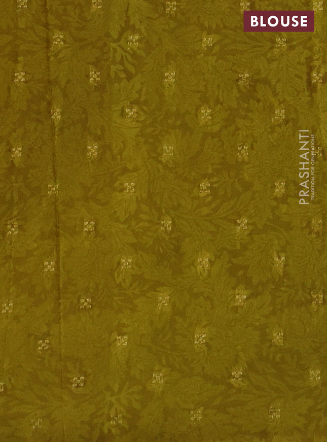 Semi mysore crepe saree beige and sap green with panel prints and long zari woven border