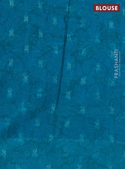Semi mysore crepe saree teal blue and blue with panel prints and long zari woven border