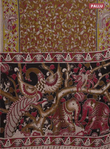 Kalamkari cotton saree dark mustard and light green with allover prints and printed border