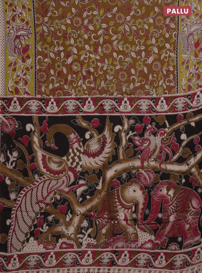 Kalamkari cotton saree dark mustard and light green with allover prints and printed border