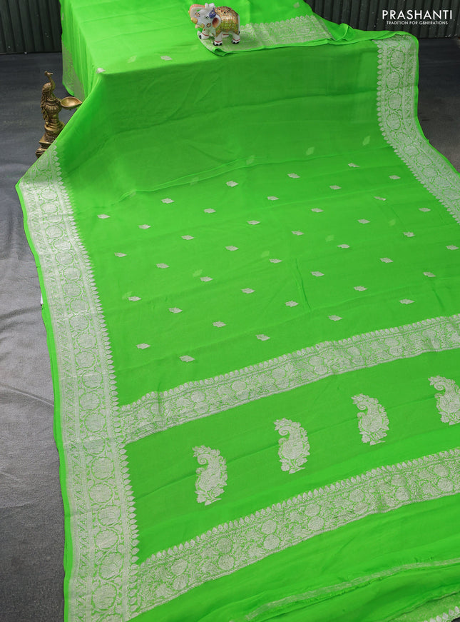 Banarasi chiffon silk saree light green with silver zari woven buttas and floral silver zari woven border