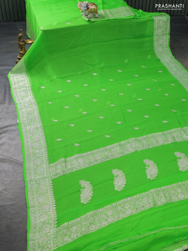 Banarasi chiffon silk saree light green with silver zari woven buttas and floral silver zari woven border
