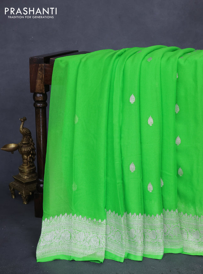 Banarasi chiffon silk saree light green with silver zari woven buttas and silver zari woven border
