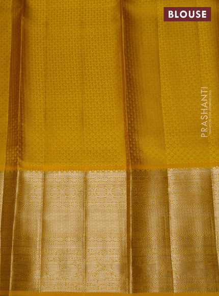 Pure kanchipuram silk lehenga lavender and yellow with allover silver zari woven broacde weaves and long zari woven border