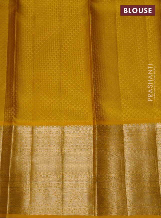 Pure kanchipuram silk lehenga lavender and yellow with allover silver zari woven broacde weaves and long zari woven border