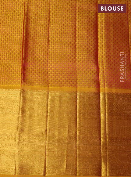 Pure kanchipuram silk lehenga dual shade of pink and mustard yellow with allover zari woven floral broacde weaves and long zari woven border