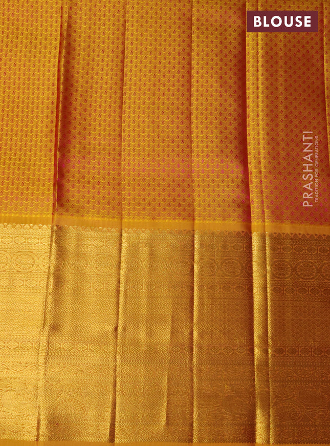 Pure kanchipuram silk lehenga dual shade of pink and mustard yellow with allover zari woven floral broacde weaves and long zari woven border