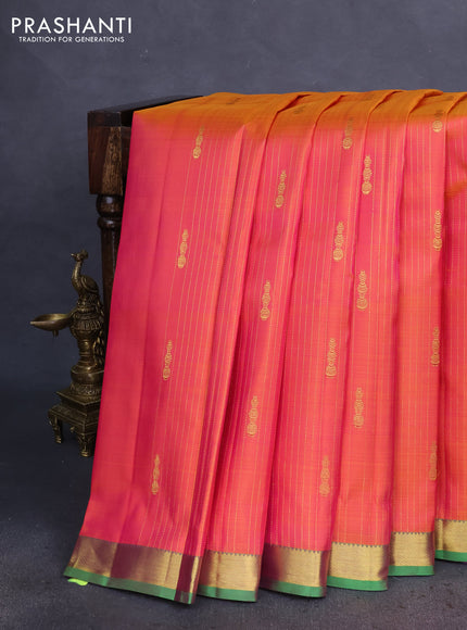 Pure kanchipuram silk saree dual shade of pinkish orange and green with allover zari weaves & butttas and zari woven border