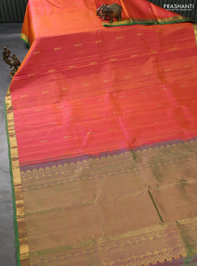 Pure kanchipuram silk saree dual shade of pinkish orange and green with allover zari weaves & butttas and zari woven border