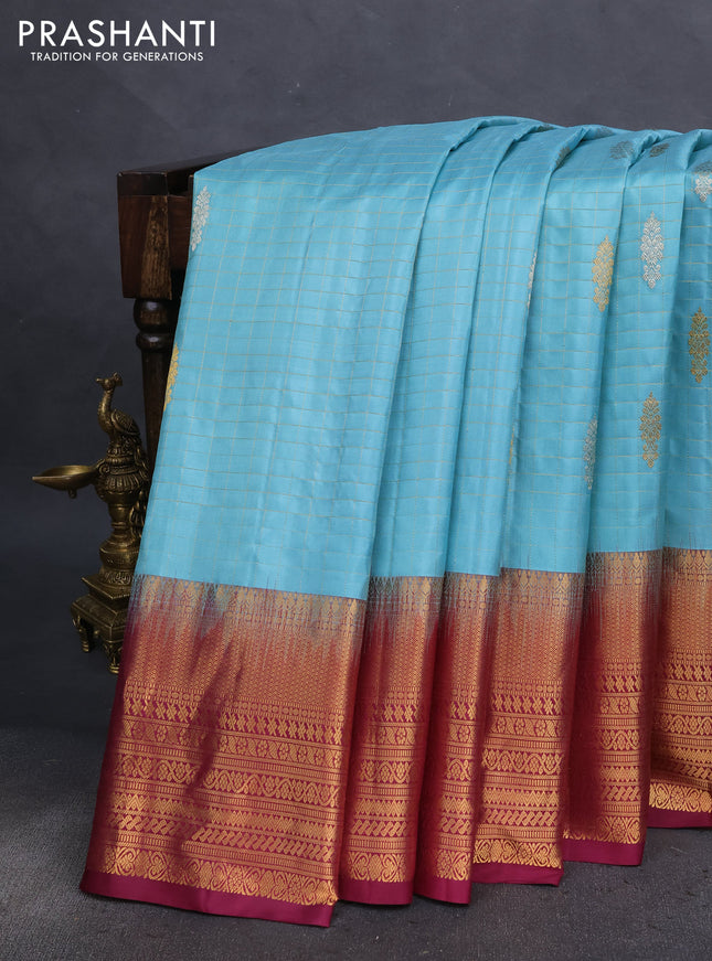 Pure gadwal silk saree light blue and wine shade with allover zari checks & buttas and long zari woven border