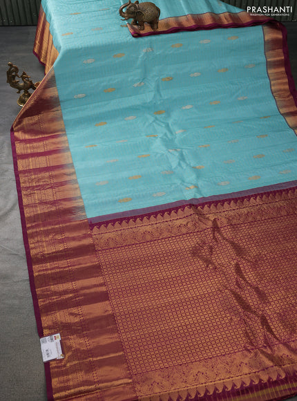 Pure gadwal silk saree light blue and wine shade with allover zari checks & buttas and long zari woven border