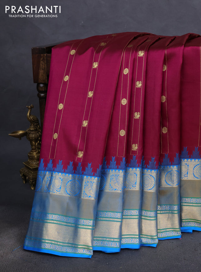 Pure gadwal silk saree wine shade and cs blue with allover zari weaves & buttas and temple design rettapet zari woven border