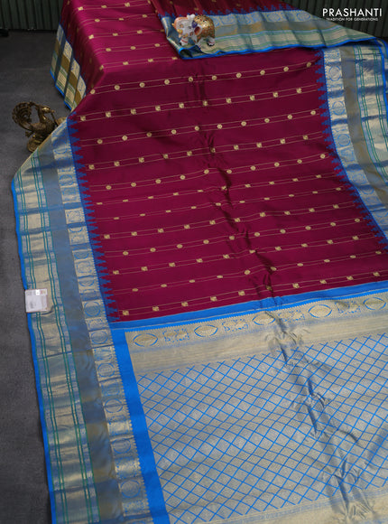 Pure gadwal silk saree wine shade and cs blue with allover zari weaves & buttas and temple design rettapet zari woven border