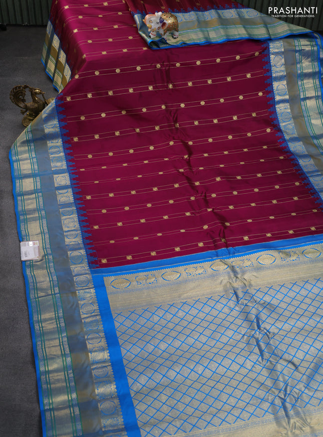 Pure gadwal silk saree wine shade and cs blue with allover zari weaves & buttas and temple design rettapet zari woven border