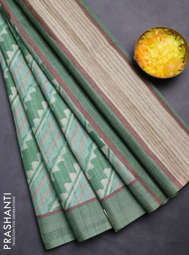 Semi tussar saree green with allover prints and simple border