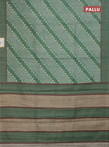 Semi tussar saree green with allover prints and simple border