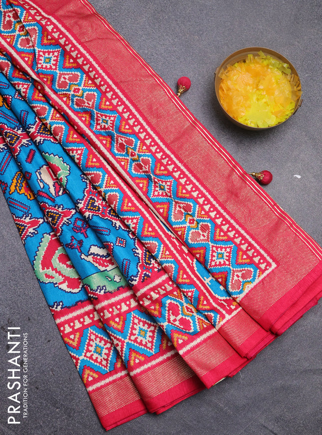 Semi pochampally silk saree teal blue and pink with patola prints and zari woven border