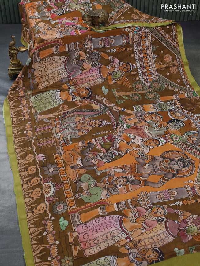 Mul cotton saree dark mustard and green with kalamkari prints and zari woven border