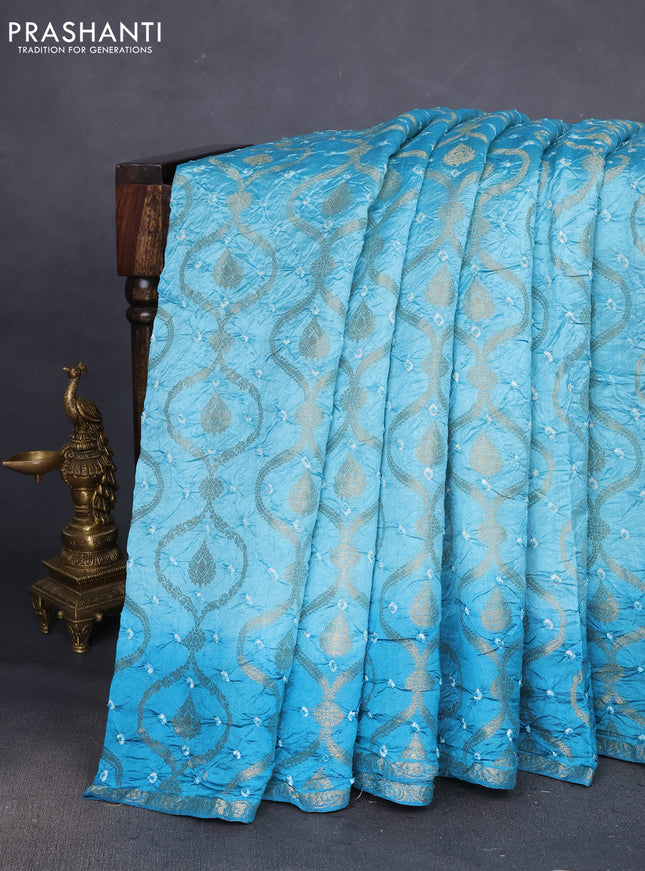 Chiniya silk saree teal blue with allover bandhani prints & zari weaves and zari woven border