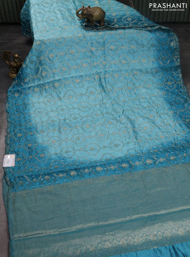 Chiniya silk saree teal blue with allover bandhani prints & zari weaves and zari woven border