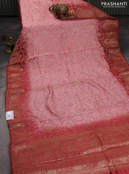 Chiniya silk saree peach pink and red shade with allover bandhani prints & zari weaves and zari woven border